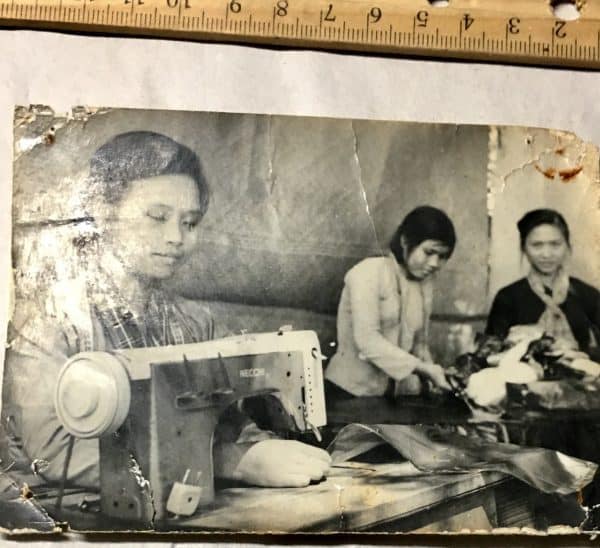 Photograph of Viet Cong Women at Sewing Machines with Scarves